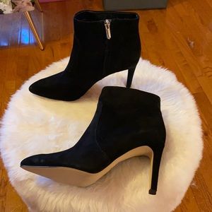 Black suede heeled boots.